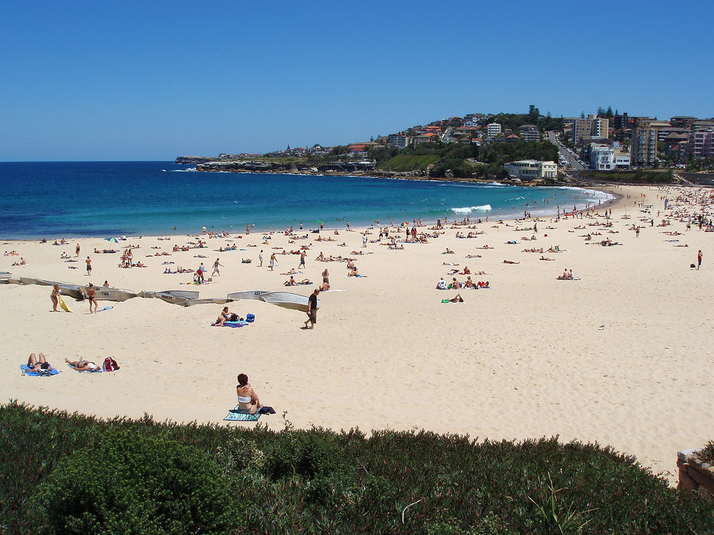 Crowds enjoying Coogee Beach on a clear sunny day
